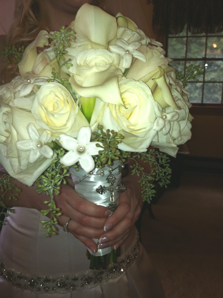 The bride's gorgeous bouquet, with something "old" -- my family's antique cross from the 1900s (I wore it for my wedding, too!)