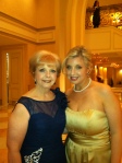 The original mom a la mode, looking stunning in a navy gown from East West Bridals