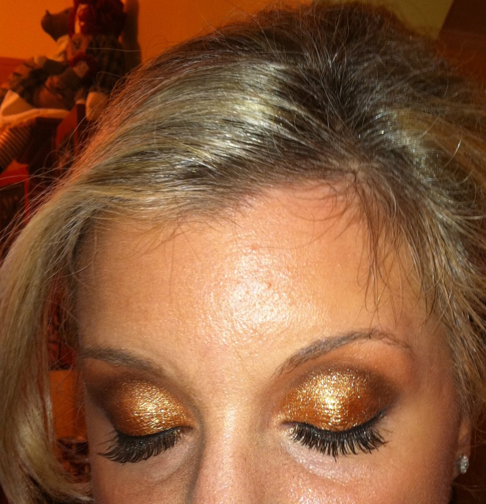 TIA Cosmetics Executive Makeup Artist, Bettina, created a sparkly eyelid to complement our gold dresses. Perfectly festive for a Christmas wedding.