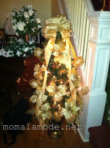 A touch of gold: my mom added the plumes and large florals to this otherwise store-bought tree